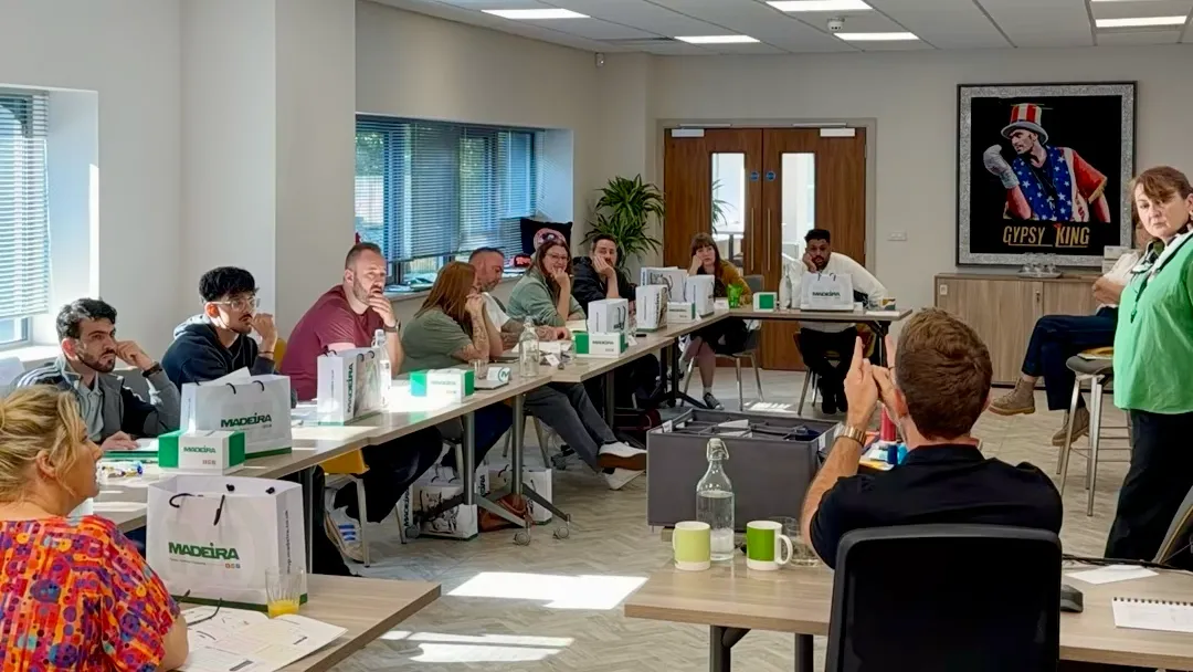 Participants attending an embroidery training session at Madeira